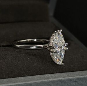 4CWT Moissanite 8-prong marquise cut set in solid S925 sterling silver.